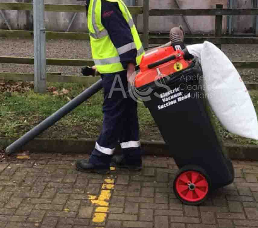 Electric Wheelie Bin vacuum collecting leaf and litter